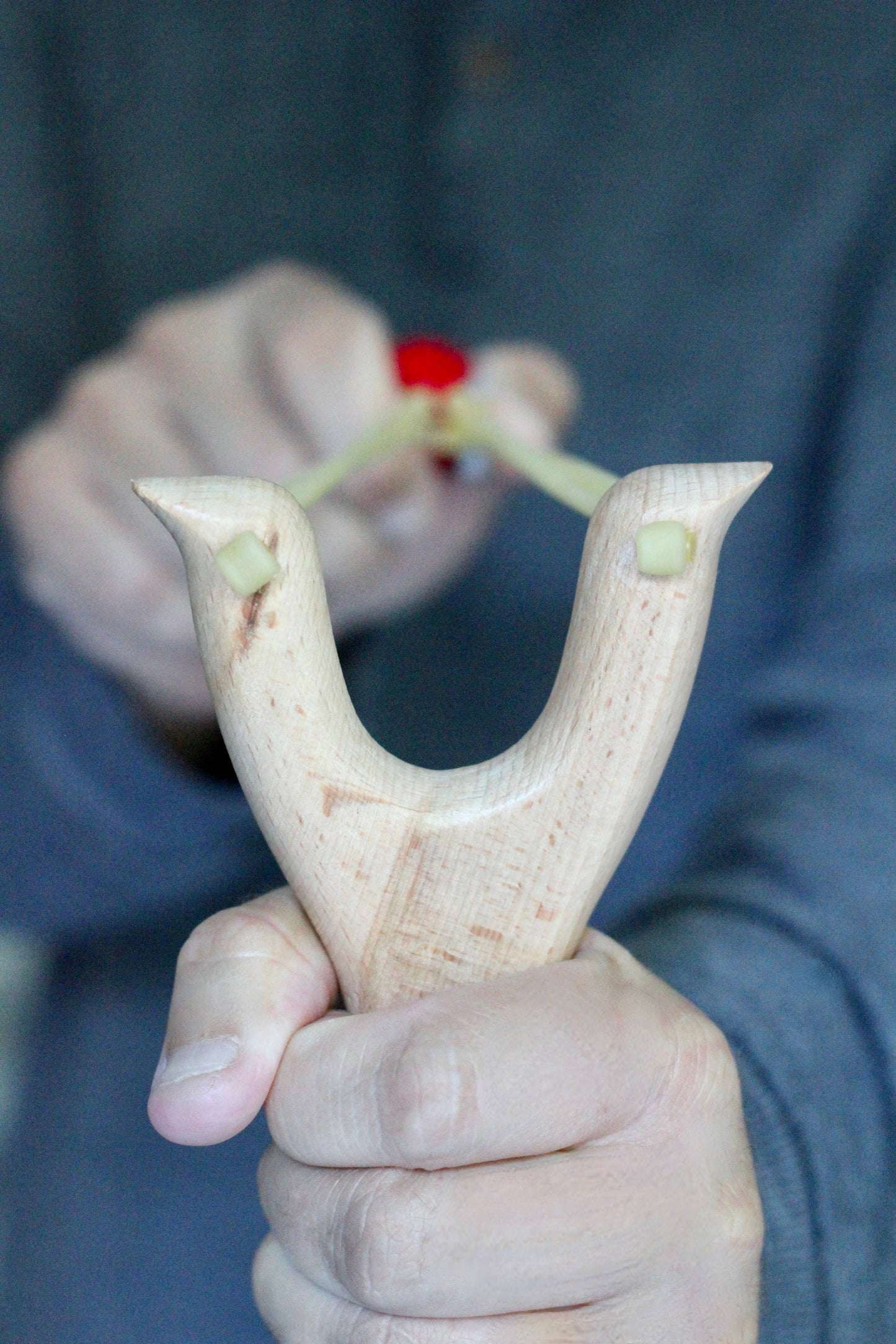 Wooden slingshot with felt balls