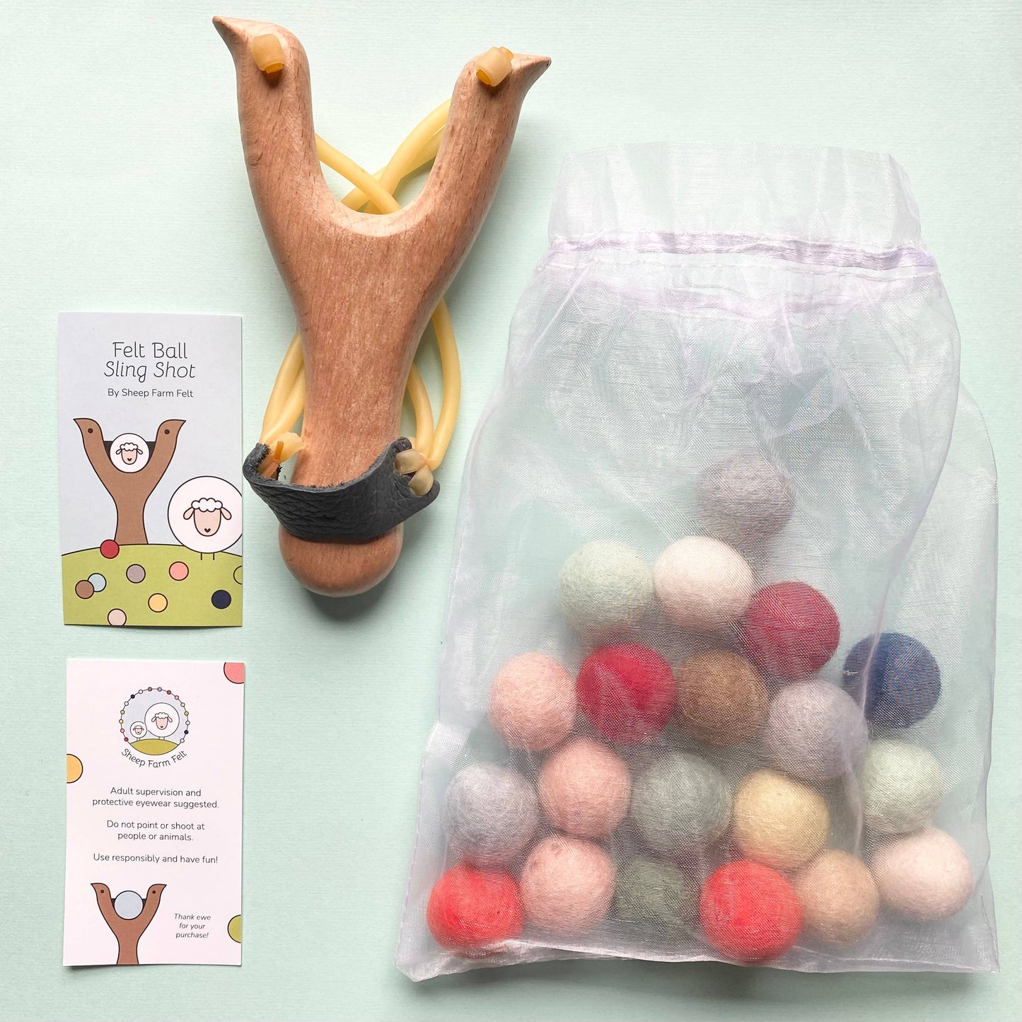 Wooden slingshot with felt balls